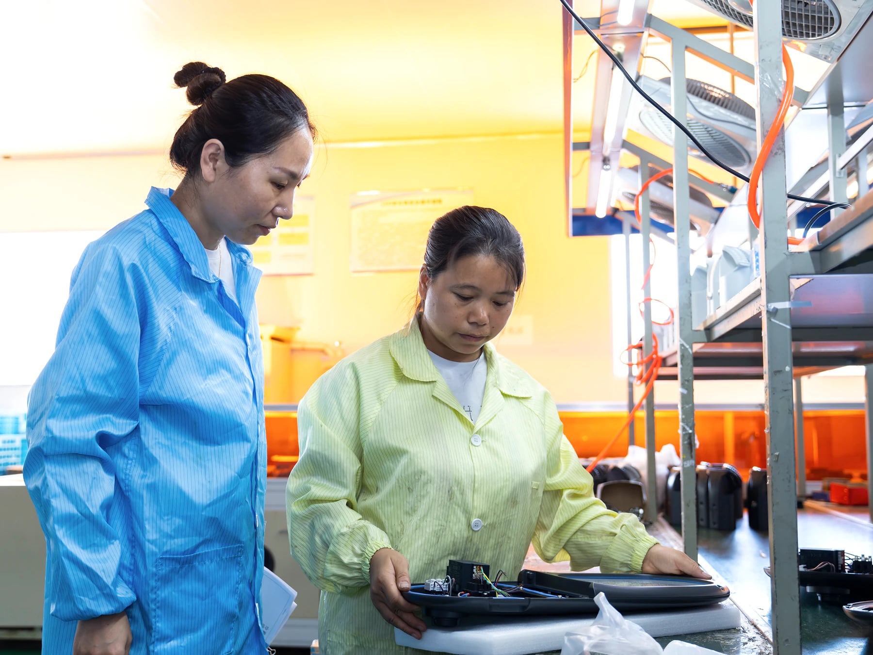 LUXiFiC production staff reviewing a finished outdoor luminaire